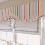 A striped valance decorating the top of a window